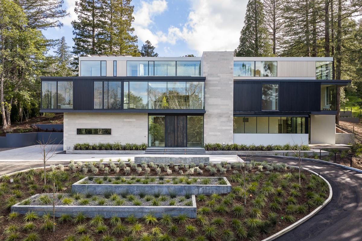A modern stone and glass home among redwoods in Hillsborough, California
